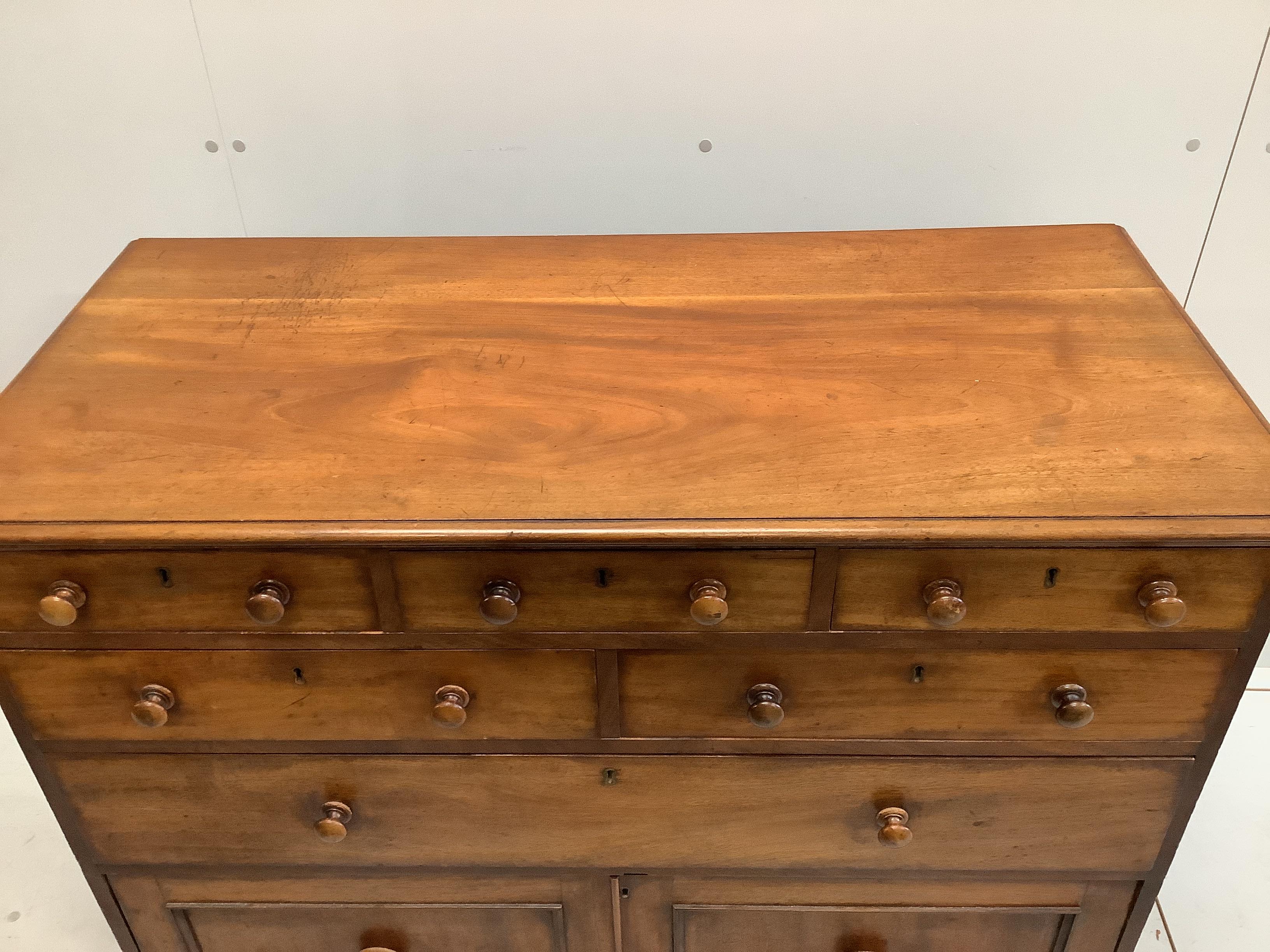 A Victorian mahogany chest fitted with an arrangement of seven drawers, width 110cm, depth 52cm, height 87cm